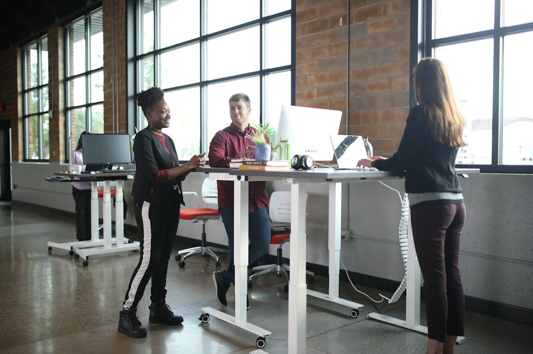 team exercising together in office