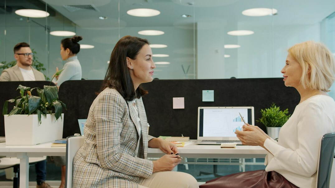 modern office workers discussing