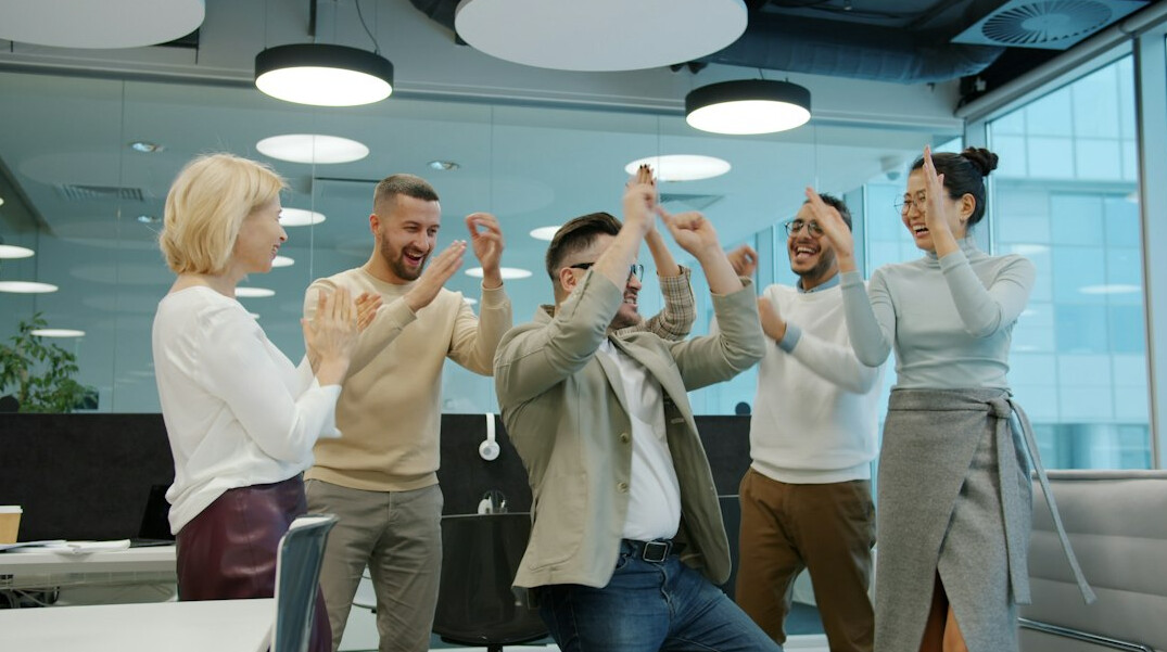 smiling colleagues in healthy workplace